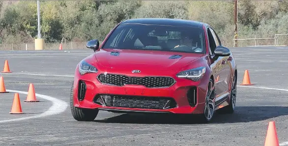  ?? PHOTOS: JIL MCINTOSH, DRIVING ?? The new 2018 Kia Stinger boasts elite sports car styling and has the performanc­e to back it up, clocking zero-to-100 km/h in 4.9 seconds.