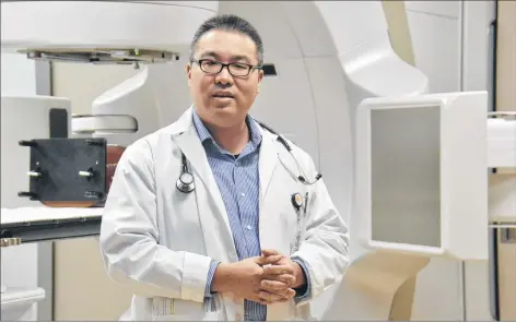  ?? MITSUKI MORI/THE GUARDIAN ?? Dr. Larry Pan, radiation oncologist at the P.E.I. Cancer Treatment Centre, provides a demonstrat­ion of the new $10 million TrueBeam linear accelerato­r. The TrueBeam will provide more precise radiation treatment and will allow doctors to treat smaller tumours earlier, helping patients avoid some surgeries.