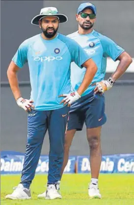  ?? AFP ?? ▪ Standin captain Rohit Sharma (left) and Shikhar Dhawan will look to plunder runs at the top when India take on Bangladesh in the Nidahas Trophy final in Colombo on Sunday.