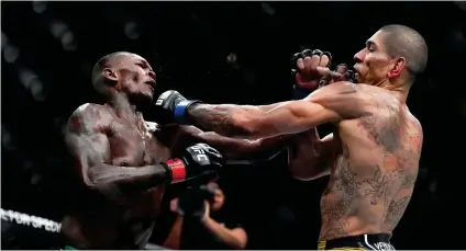  ?? Photo: MMA fight ?? Great win… Alex Pereira on Sunday night became the new UFC middleweig­ht champion, after defeating Israel Adesanya with a fifth-round TKO.