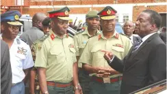  ??  ?? President Mnangagwa speaks to Commander Zimbabwe Defence Forces General Philip Valerio Sibanda, while Zimbabwe National Army Commander Lieuten - ant-General Edzai Chimonyo (second from left) and Air Marshal Elson Moyo look on after watching the Chinhoyi 7 Battle film première in Harare in 2018