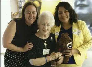  ?? PHOTO COURTESY OF YULIL ALONSO-GARZA ?? FROM LEFT: Gruwell, Holocaust survivor Renee Firestone and Alonso-Garza on Monday in Long Beach pose with a SmashBro Bear, which Alonso-Garza's Mothers and Men Against Gangs Coalition has used to honor the death of her son, Martin Alberto Garza.