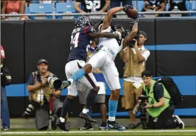  ?? MIKE MCCARN / AP ?? Panthers wide receiver Kelvin Benjamin stretches over Texans cornerback Johnathan Joseph to catch a touchdown in Wednesday night’s exhibition game.