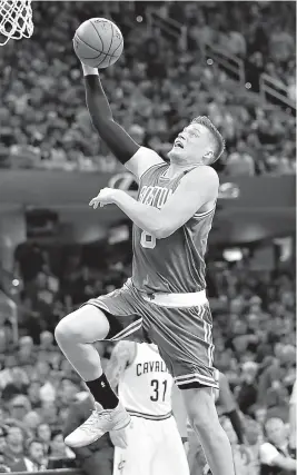  ?? AP Photo/Tony Dejak ?? Boston Celtics' Jonas Jerebko (8), from Sweden, goes up for a dunk against the Cleveland Cavaliers during the first half of Game 4 of the NBA basketball Eastern Conference finals Tuesday in Cleveland.