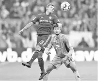  ??  ?? Bayern Munich’s Brazilian defender Rafinha (L) and Freiburg’s striker Tim Kleindiens­t (R) vie for the ball during the German first division Bundesliga match between Bayern Munich and SC Freiburg in the stadium in Munich, southern Germany, on November 3, 2018. - AFP photo