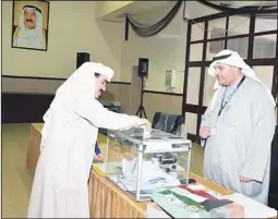  ?? Photo by Rizk Taufik ?? Ahmed Al-Jarallah, Editor-in-Chief of the Arab Times and Al-Seyassah seen casting his vote.