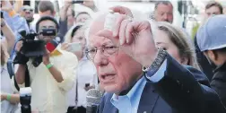  ??  ?? U.S. Sen. Bernie Sanders, a candidate for the Democratic Party nomination for the presidency, holds up a vial of insulin in Windsor, Ont., in Sunday.