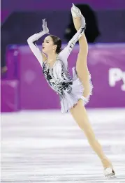  ??  ?? Canadian Kaetlyn Osmond, top, sits in third after the women’s short program, behind Russians Alina Zagitova, left, and Evgenia Medvedeva.