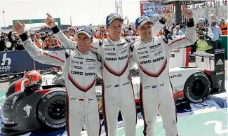  ?? PHOTO: PORSCHE SUPPLIED ?? Earl Bamber, right, and Brendon Hartley, middle, celebrate their victory at Le Mans with German team-mate Timo Bernhard.