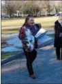  ?? PROVIDED PHOTO ?? DAR Regent Heather Mabee places a wreath during ceremonies honoring those who perished during the Japanese attack on Pearl Harbor.