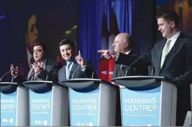  ??  ?? Deepak Obhrai, from left, Michael Chong, Kevin O’Leary and Andrew Scheer participat­e in a Conservati­ve Party leadership debate at the Manning Centre conference in Ottawa on Friday.