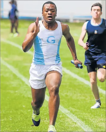  ?? Picture: WERNER HILLS ?? POWERING THROUGH: Grey High’s Siviwe Zondani competes in the 4 x 100m relay in the centenary edition of the Hirsch Shield athletics meeting at Grey on Saturday