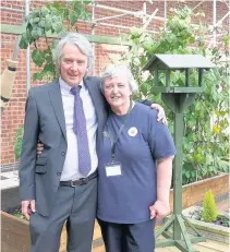  ??  ?? Pictured is Tony Donovan, executive director of Age UK Leicester Shire & Rutland, with a Tesco Community Supporter.
