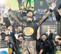  ?? JOE CAVARETTA/STAFF PHOTOGRAPH­ER ?? Martin Truex Jr. celebrates his emotional victory in the Ford EcoBoost 400 on Sunday at the Homestead-Miami Speedway. Truex says he cried after crossing the finish line.