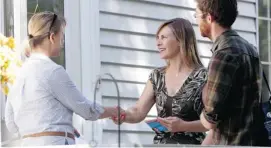  ?? DAVID KAWAI / OTTAWA CITIZEN ?? New Democrat candidate Bronwyn Funiciello, centre, goes door to door in Ottawa South in advance of the Aug. 1 byelection. She feels there is ‘definitely an appetite for change.’