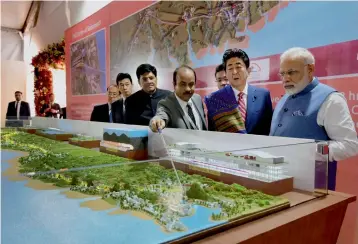 ?? — PTI ?? Prime Minister Narendra Modi with his Japanese counterpar­t Shinzo Abe at Ground Breaking ceremony of MumbaiAhme­dabad High Speed Rail Project, in Ahmedabad on September 14