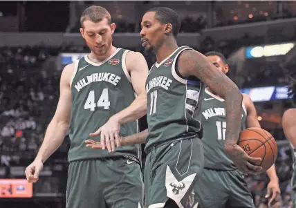  ?? JUSTIN FORD / USA TODAY SPORTS ?? Brandon Jennings and Tyler Zeller savor a moment Monday night.