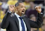  ?? ASSOCIATED PRESS FILE PHOTO ?? Michigan coach Juwan Howard calls in a play to the team as it played against Nebraska during the first half of a March 5 game in Ann Arbor.