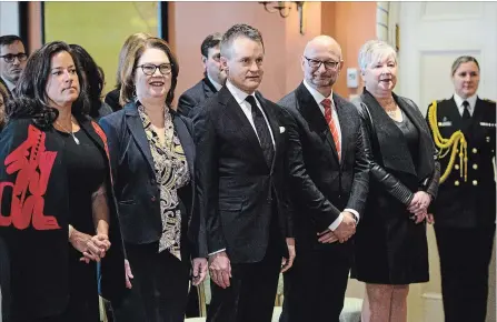  ?? SEAN KILPATRICK THE CANADIAN PRESS ?? Veterans Affairs Minister Jody Wilson-Raybould, left, Treasury Board President Jane Philpott, Indigenous Services Minister Seamus O’Regan, Justice Minister David Lametti and Minister of Rural Economic Developmen­t Bernadette Jordan attend a swearing-in ceremony at Rideau Hall.