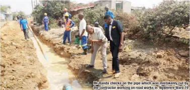  ??  ?? Mr Banda checks on the pipe which was mistakenly cut by the contractor working on road works in Ngwerere Ward 19