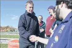  ?? MICHAEL MCANDREWS | SPECIAL TO THE COURANT ?? AMONG THE STOPS Democrat Ned Lamont made on Saturday was a women’s rally in Meriden, where he shook the hands of some supporters.