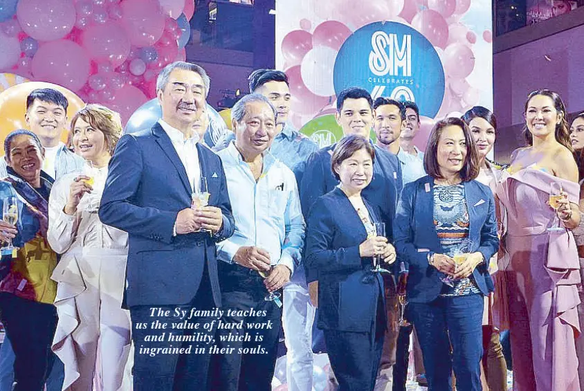  ??  ?? Celebratin­g SM’s 60th anniversar­y. (from left): SM Prime executive committee chairman Hans T. Sy, SM Markets vice chair Herbert T. Sy, SM Investment­s vice chair Teresita Sy-Coson and SM Hotels and Convention­s Corp. president Elizabeth T. Sy during the...