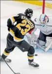  ?? STUART CAHILL / BOSTON HERALD ?? Bruins center Jack Studnicka takes a shot on Capitals goaltender Vitek Vanecek at TD Garden on Friday night.