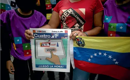  ?? AP ?? Supporters of Venezuela’s President, Nicolas Maduro, take part in a closing campaign rally in the capital, Caracas. The election could hand Maduro control of the National Assembly, the last major institutio­n outside his grasp.