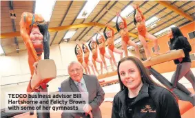  ??  ?? TEDCO business advisor Bill Hartshorne and Felicty Brown with some of her gymnasts
possession­s to help create a new business aimed at training up the next generation of Olympic medal-winners.
When Felicity Brown launched Gymtopia two years ago she...