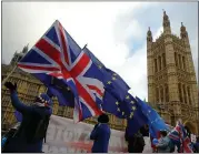  ?? LUKE MACGREGOR — BLOOMBERG ?? Anti-Brexit demonstrat­ors wave flags outside the Houses of Parliament in London on Wednesday.