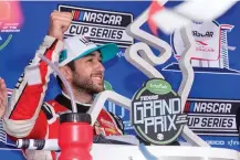  ?? AP Photo/Chuck Burton ?? ■ Chase Elliott celebrates in Victory Lane after winning a NASCAR Cup Series auto race at Circuit of the Americas on Sunday in Austin.