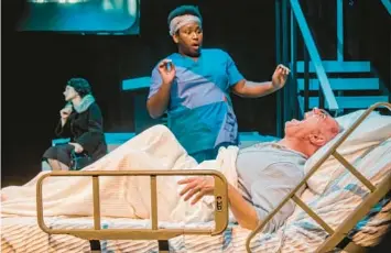  ?? CHRIS BRIDGES, VALENCIA COLLEGE ?? Roy (John DiDonna, in bed) gives Belize (Marquise Hillman) a fright, while Ethel Rosenberg (Sarah Lockard) lends a ghostly presence to “Angels in America, Part Two: Perestroik­a” at Valencia College Theatre.