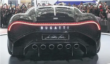  ?? STEVE RUSSELL TORONTO STAR ?? Bugatti’s La Voiture Noire, the world’s most expensive car — it has a $16.1-million price tag — was unveiled at the 47th Canadian Internatio­nal AutoShow’s media preview on Thursday. The car pays homage to the iconic Type 57 SC Atlantic.