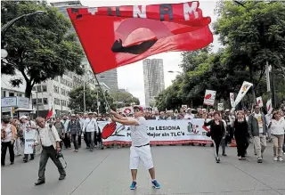  ?? GUSTAVO MARTINEZ CONTRERAS THE ASSOCIATED PRESS ?? Thousands of workers from the National Autonomous University of Mexico shut down Reforma Avenue in 2017 to demand Mexico step out of the NAFTA renegotiat­ions.