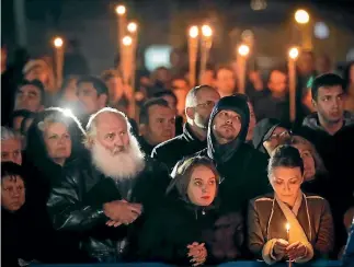  ?? PHOTOS: AP ?? Romanians mourn King Michael who died in Switzerlan­d.