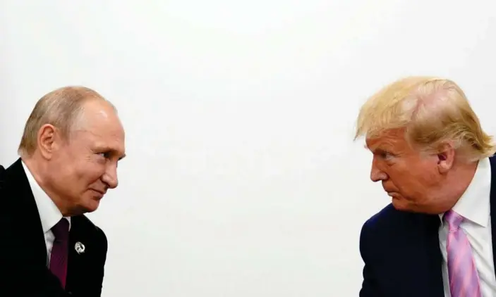  ?? Photograph: Kevin Lamarque/Reuters ?? Donald Trump and Vladimir Putin in Osaka last year. The pair spoke by phone six times between 30 March and 1 June apparently without the Afghanista­n issue being mentioned.