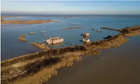  ?? Photograph: Marta Clinco and Andrea Lops/The Guardian ?? Sunken buildings on Batteria, an island in the Po delta, affected over decades by flooding and subsidence aggravated by methane gas drilling.