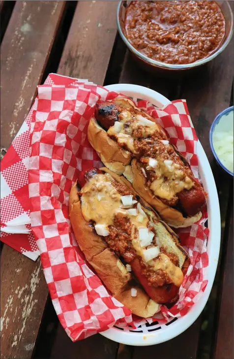  ?? (Pittsburgh Post-Gazette/TNS/Gretchen McKay) ?? An all-beef hot dog topped with homemade Detroit-style chili sauce is an easy dish for your Memorial Day picnic.