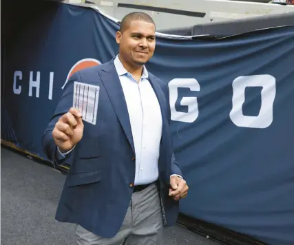  ?? CHRIS SWEDA/CHICAGO TRIBUNE ?? Bears general manager Ryan Poles walks onto the field to take in warmups for a game against the Texans in September at Soldier Field.