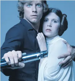  ?? TERRY O’NEILL / GETTY IMAGES ?? Mark Hamill and Carrie Fisher carved immortalit­y as Luke Skywalker and Princess Leia in the Star Wars saga.