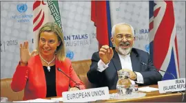  ?? Picture: REUTERS ?? DONE DEAL: EU representa­tive for foreign affairs and security policy Federica Mogherini, left, and Iranian Foreign Minister Mohammad Javad Zarif at the UN building in Vienna yesterday.