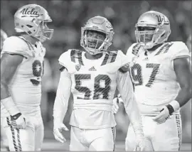  ?? Rick Scuteri
Associated Press ?? UCLA linebacker Deon Hollins (58) says of the defense after its learning curve for the young players: We have been tremendous against the run the last few games.”