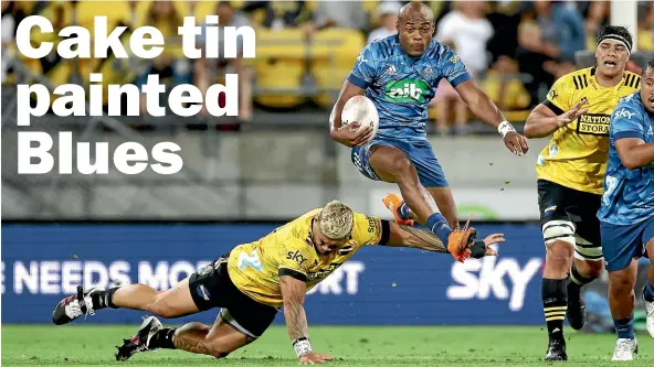  ?? PHOTOSPORT ?? Blues Mark Telea hurdles Hurricanes Alex Fidow during last night’s Super Rugby Aotearoa match between the Hurricans and Blues at Sky Stadium in Wellington.