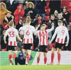  ??  ?? Lynden Gooch and his Sunderland team-mates celebrate a goal in the victory over Rochdale.