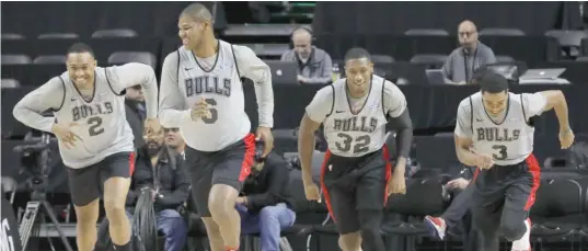  ?? REBECCA BLACKWELL/AP ?? Bulls players Jabari Parker (from left), Cristiano Felicio, Kris Dunn and Shaquille Harrison warm up before practicing Wednesday in Mexico City.