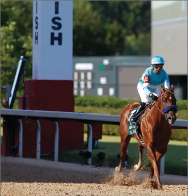  ?? (Arkansas Democrat-Gazette/Thomas Metthe) ?? Charlatan romped to victory by 6 lengths in the first division of the Arkansas Derby on Saturday at Oaklawn in Hot Springs. See more photos at arkansason­line.com/53derby/.