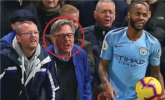  ??  ?? Tirade: Colin Wing, circled, was caught on camera just inches from Raheem Sterling who he abused throughout the match