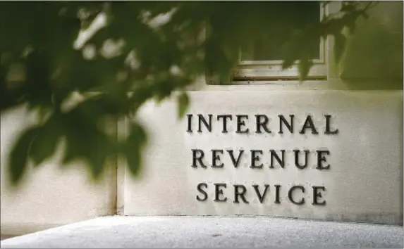  ?? PATRICK SEMANSKY, FILE — THE ASSOCIATED PRESS ?? A sign is displayed outside the Internal Revenue Service building on May 4, 2021, in Washington.