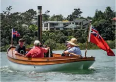  ?? ?? BELOW A rare, colourful – and noisy – breed, steamboat enthusiast­s celebrate a bygone era of marine transport.