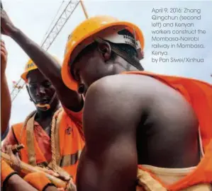  ??  ?? April 9, 2016: Zhang Qingchun (second left) and Kenyan workers construct the Mombasa-nairobi railway in Mombasa, Kenya. by Pan Siwei/xinhua